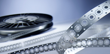 Chemically etched metal sieves on a reel